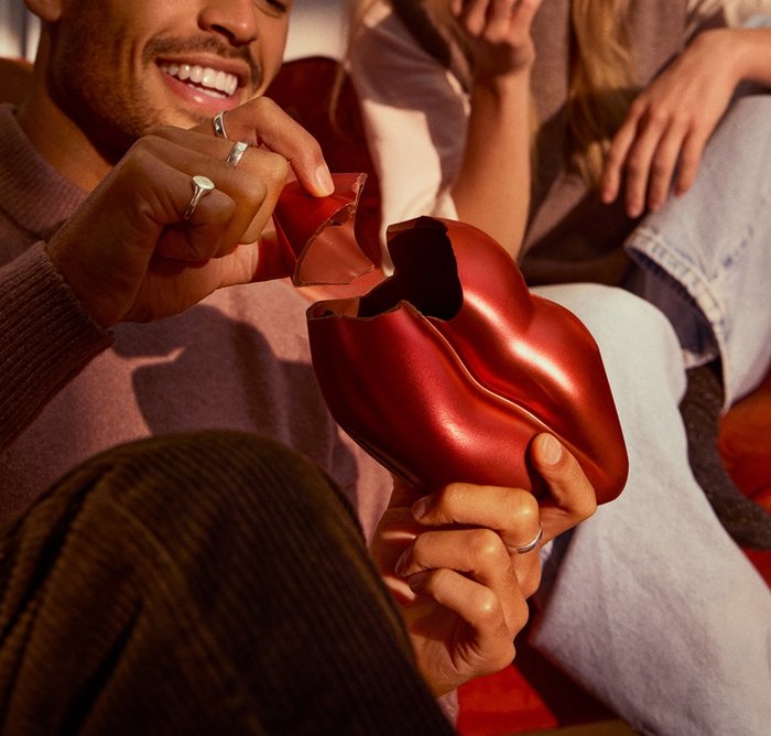 People eating lip shaped chocolate