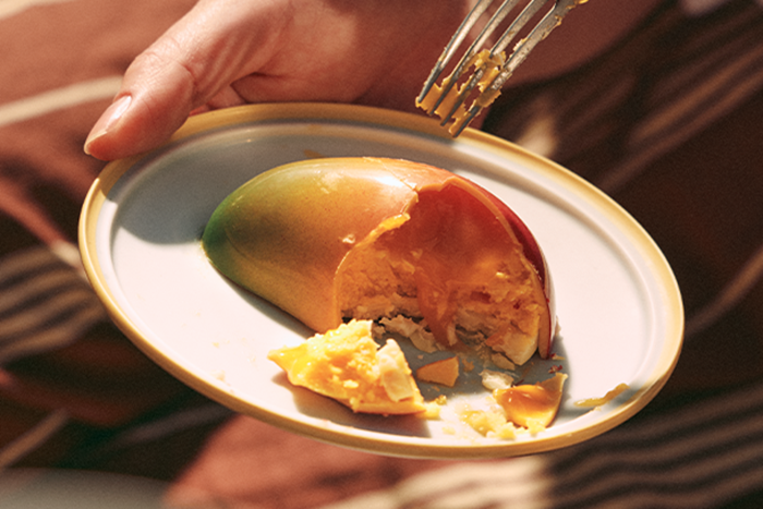 People eating mango dessert